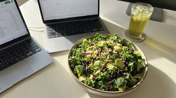 Kale salad with green tea on professional table
